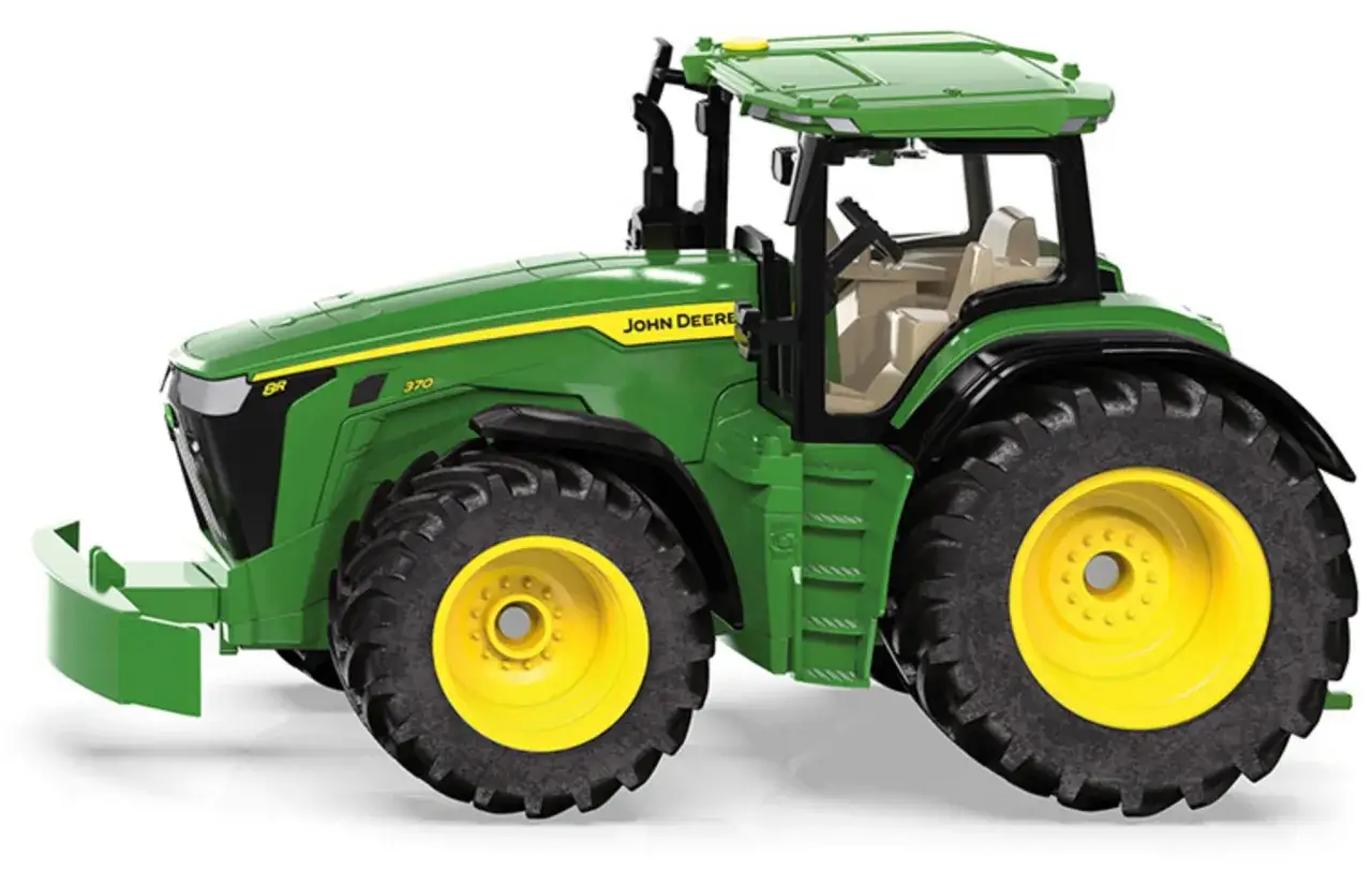 Zielony traktor John Deere z ż&oacute;łtymi felgami i czarnymi oponami, gotowy do pracy na polu.